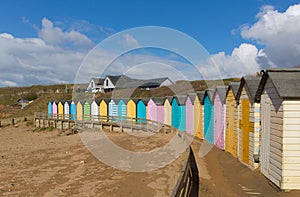 Colourful pastel beach huts on the beach Bude North Cornwall England uk