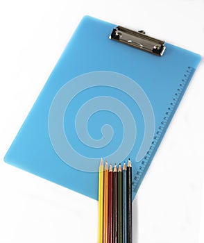 Colourful pencils and clipboard