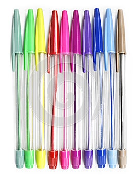 Colourful pens on a white background