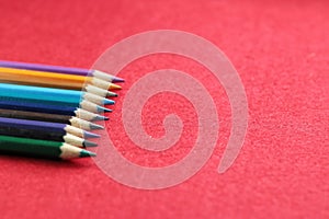 Colourful pensil with red background