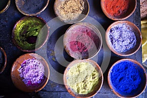 Colourful pigment dyes in bowls, Marrakesh, Morocco