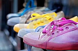 Colourful plimsolls in a row