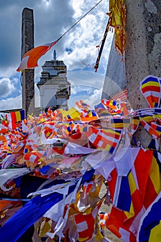 Colourful prayer flags flying at Ruwanwelisaya stupa in Anuradhapura