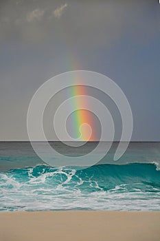 Colourful rainbow over the sea in a tropical beach