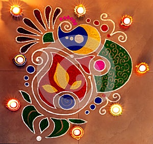 Colourful rangoli with deepak