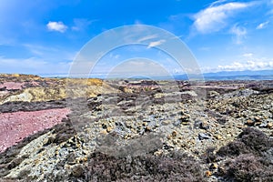 The colourful remains of the former copper mine Parys Mountain near Amlwch on the Isle of Anglesey, Wales, UK