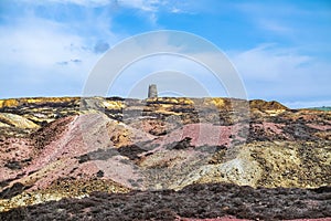 The colourful remains of the former copper mine Parys Mountain near Amlwch on the Isle of Anglesey, Wales, UK