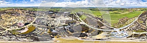 The colourful remains of the former copper mine Parys Mountain near Amlwch on the Isle of Anglesey, Wales, UK