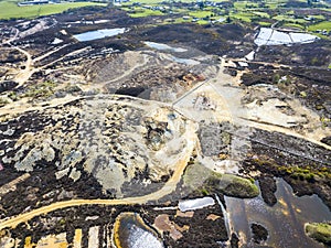 The colourful remains of the former copper mine Parys Mountain near Amlwch on the Isle of Anglesey, Wales, UK