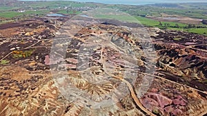 The colourful remains of the former copper mine Parys Mountain near Amlwch on the Isle of Anglesey, Wales, UK