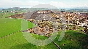 The colourful remains of the former copper mine Parys Mountain near Amlwch on the Isle of Anglesey, Wales, UK