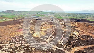 The colourful remains of the former copper mine Parys Mountain near Amlwch on the Isle of Anglesey, Wales, UK