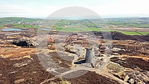 The colourful remains of the former copper mine Parys Mountain near Amlwch on the Isle of Anglesey, Wales, UK