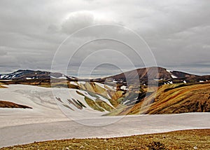 Colourful rhyolite mountains under snow, Laugavegur hiking trail, Fjallabak Nature Reserve, Highlands of Iceland, Europe