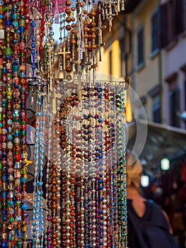 Colourful rosaries on an italian market