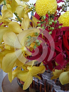 Colourful rose and orchid flower basket