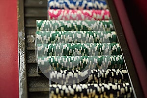 Colourful roulette chips in a casino on a gambling table.