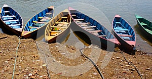 Colourful Rowing Boats tied to the Shore in Pokhara Lake, Nepal