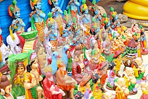 Colourful sculptures of Indian hindu Gods and sri buddha for selling from bengaluru road