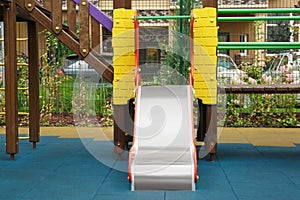 Colourful slide outdoor playground for children in residential area
