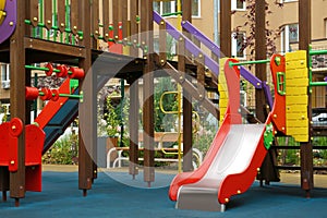 Colourful slide outdoor playground for children in residential area