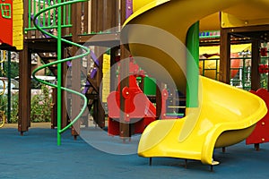 Colourful slide on outdoor playground for children in residential area