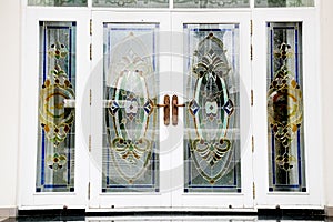 Colourful stained glass wooden door of a traditional