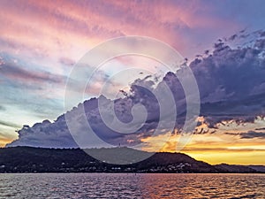 Colourful stormy pink and yellow coloured Cirrus cloudy coastal Sunset Seascape, Australia