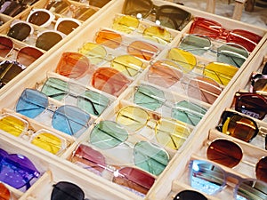 Colourful Sunglasses Fashion shopping in wooden box Hipster Lifestyle