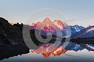 Colourful sunset on Lac Blanc lake in France Alps