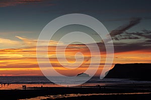 Colourful sunset over the beach at Polzeath