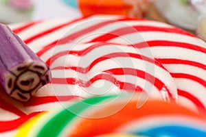 Colourful sweets candy rainbow and peppermint swirl lollipop close up