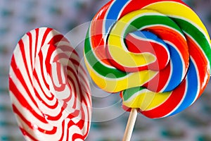 Colourful sweets candy rainbow and peppermint swirl lollipop close up macro photography