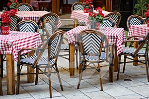 Colourful table cloths on restaurant table and chairs