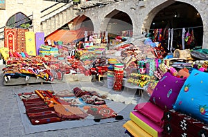 Colourful textiles in Doha market