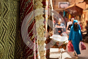 Colourful textiles for sale at the street bazaar in Medina