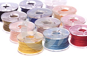 Colourful Thread Bobbins Macro Isolated