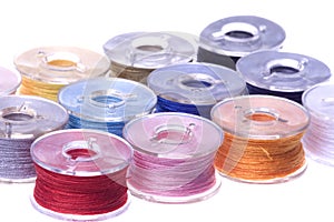 Colourful Thread Bobbins Macro Isolated
