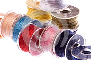 Colourful Thread Bobbins Macro Isolated