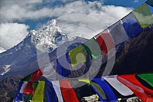 Colourful Tibetan prayer flags with Mt. Ama Dablam in the backdrop