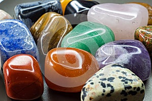 Colourful tumbled gemstones and crystals