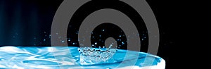 Colourful water splash - water droplet on dark background - ocean blue water droplet