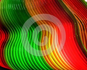 Colourful waving lines in red and green abstract background