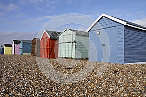 Colourful wooden beach huts on a sunny day on Hayl