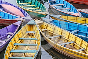 Colourful wooden boats at Fewa Lake