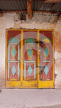 A colourful wooden door at a cabin in Toubkal National Park, Morocco