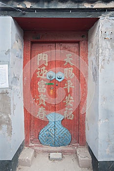 Colourful wooden door of a traditional hutong building, Beijing