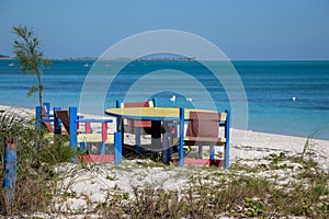 colourful wooden furniture on a beach photo