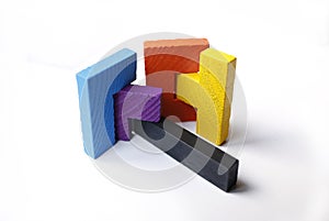 Colourful wooden puzzle blocks on white background