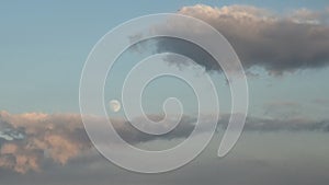 Colourfull evening sky with almost full moon